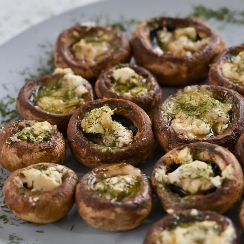 Stuffed mushrooms with cream cheese and herbs, a delicious holiday appetizer perfect for Christmas gatherings.