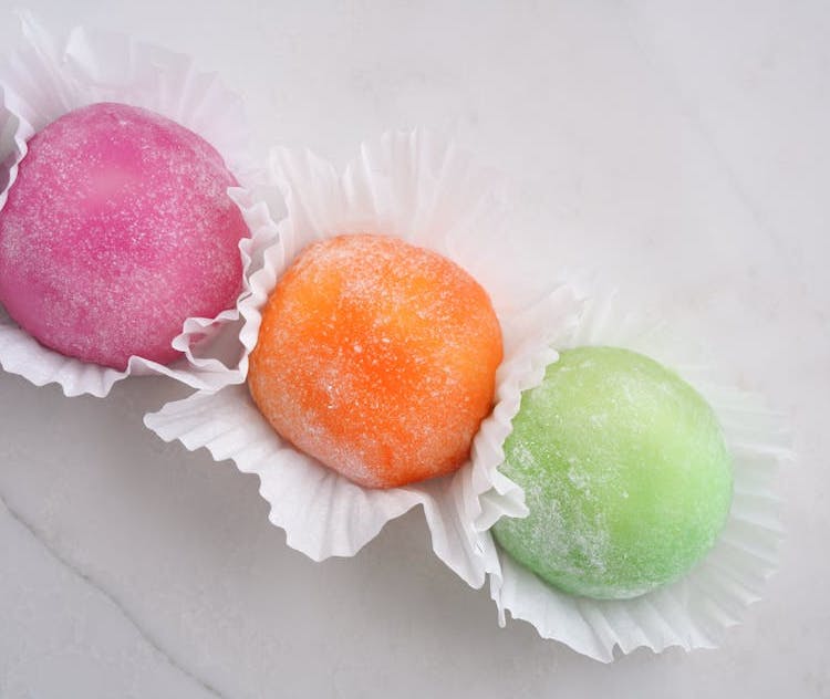 Chewy and sticky mochi. Rice cakes with matcha and red bean filling, a popular Japanese treat for celebrations and festivals.