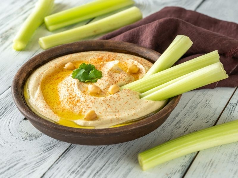 Celery sticks with hummus, a low carb snacks for diabetics, offering a healthy and satisfying crunch.