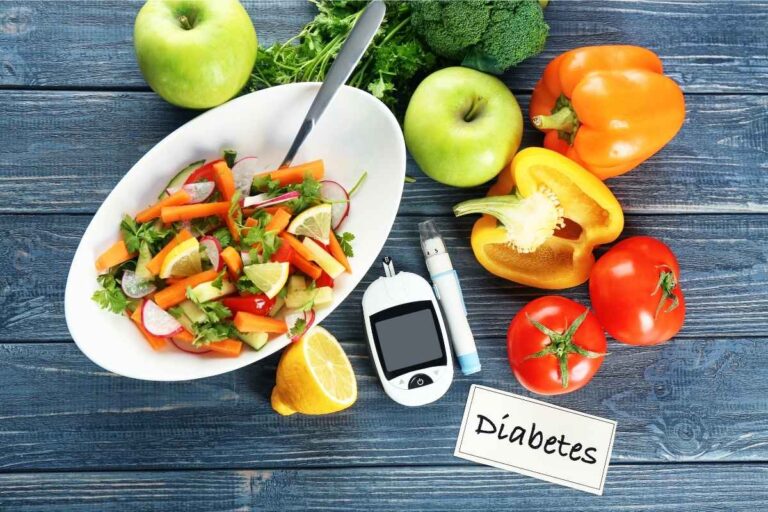 A bowl of Low Carb Snacks for diabetics along with fruits and vegetables, Digital Glucometer and Lancet Pen showcasing a diabetes lifestyle.